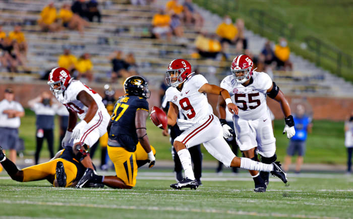 Alabama's Bryce Young runs with the ball